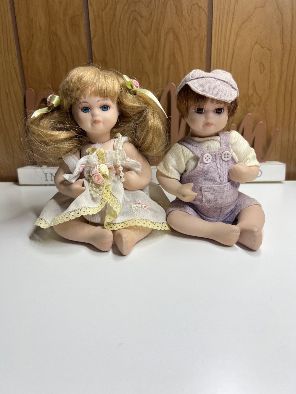 Vintage Porcelain Sitting Dolls Boy and Girl Pair Fabric Outfit Set of 2